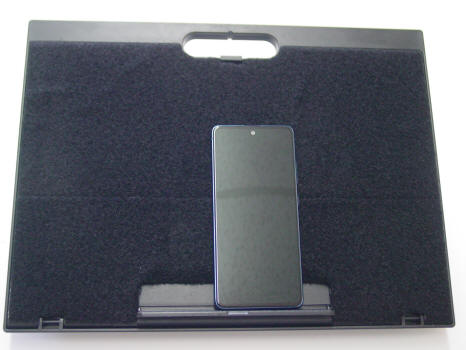Mobile Telephone laying on a Lap Tray