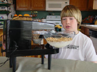 Child Using an Assistive Dining Device