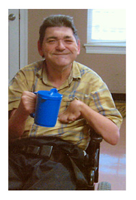 Man holding a Thickened Liquids Cup